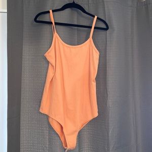 Body suit. Never seen worn, tags have been removed